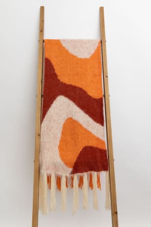 groovy-swirl-tassel-scarf-rust/Rust