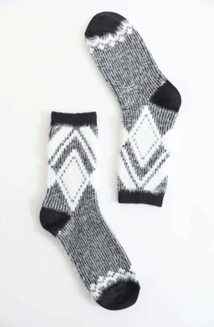 Pair of gray socks with black, gray and white pattern on a white background