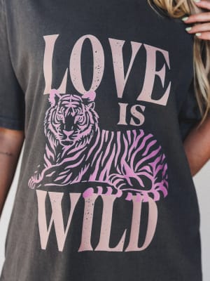 Black t-shirt with pink tiger graphic and 'Love is Wild' text