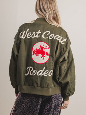 Green jacket with 'West Coast Rodeo' text and logo on a plain background