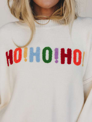 White sweater with colorful 'HO! HO! HO!' text