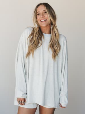 An oversized ribbed long-sleeve top in soft baby blue paired with matching shorts — the kind of effortless matching set that makes staying in feel like a whole look.