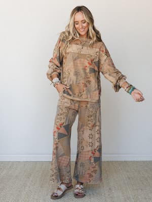 A matching patchwork two-piece set in warm latte tones — the kind of outfit that looks like it was pieced together from your grandmother's vintage quilt collection, in the best possible way.