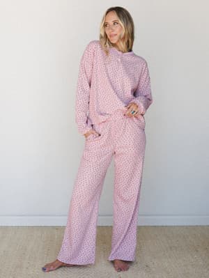 A relaxed matching two-piece set in blush pink with a tiny ditsy floral print — the kind of outfit that makes staying home feel like a whole personality.
