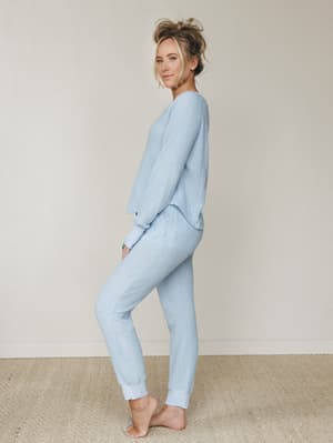 A soft, matching ribbed knit set in powder blue — the kind of outfit that makes staying home feel like a whole personality.