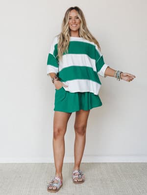 A bright, happy matching set in bold green and white stripes — the oversized top and pull-on shorts feel like the kind of outfit you throw on and somehow look totally put-together in.