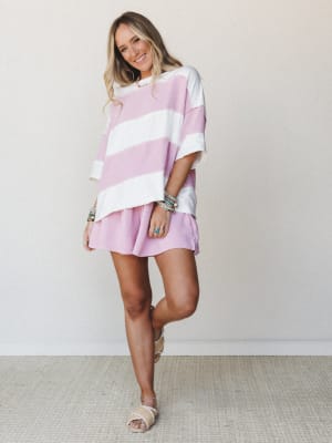A relaxed two-piece set in orchid pink and ivory stripe — the oversized top and matching shorts feel like the kind of outfit you throw on and somehow look completely put together.