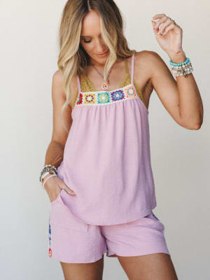 A flowy orchid pink cami tank with a colorful granny square crochet yoke is paired with matching pink shorts — the kind of effortless summer set that feels like it was made for a slow, happy day.