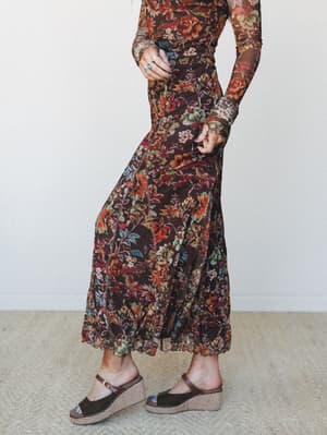 A rich chocolate floral mesh maxi skirt paired with wedge espadrille sandals — the kind of fall outfit that feels equally at home at a farmers market or a birthday dinner.