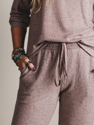 Brown textured outfit with drawstring pants on a neutral background