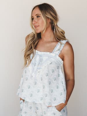 A flowy floral cami top in soft powder blue pairs with matching wide-leg shorts for a set that reads equally well as a dreamy sleep look or a casual summer day — sweet, soft, and a little vintage in the best way.