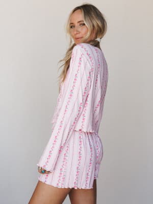 A soft, dreamy PJ short set in blush pink with delicate floral stripe print — the kind of thing you'd wear on a slow morning and somehow never want to take off.