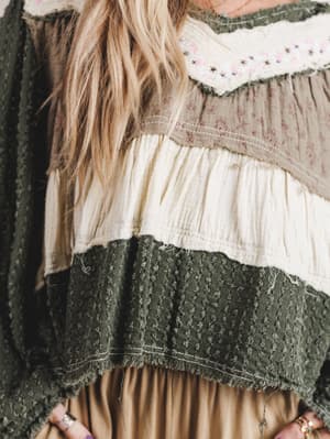 Layered fabric with lace and embroidery details
