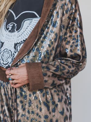 Close-up of a person wearing a patterned outfit with a focus on the fabric texture.