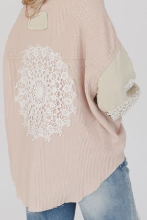 Someone wearing the Way Home Patch Detail Shacket - Beige, featuring a loose fit, boho style, and patchwork accents, paired with blue jeans.