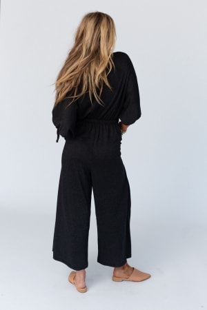 back view of The Nest Carolina Comfy Wide Leg Jumpsuit in Charcoal from Three Bird Nest