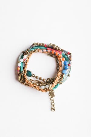 The Sunburst Stacked Bracelet Set - Multi features blue, pink, orange, and gold beads with a gold chain and turquoise cord—perfect for a vibrant boho stack. Styled in a circle on a white background.