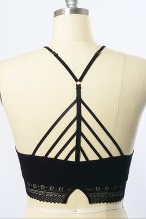 The Light Of The Moon Crochet Trim Bralette in black is shown on a dress form, boasting a high neck, multiple crisscrossing back straps, and delicate crochet trim along the bottom band.